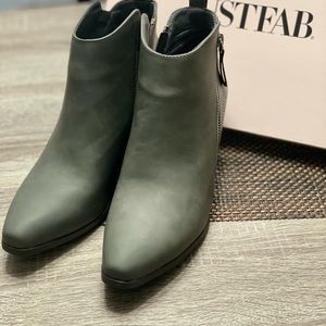 Woman’s size 7.5 heeled ankle booties.